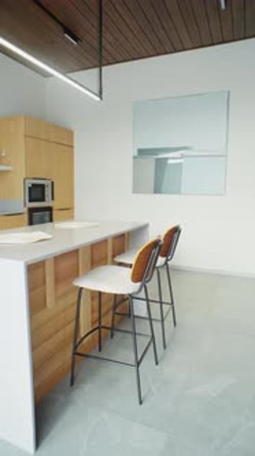 Breakfast Bar And High Stools In Bright Kitchen Niche
