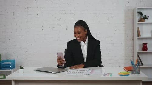 Cheerful Woman in Office Video Call