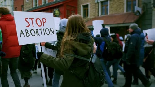 Group of People Protesting on City Street