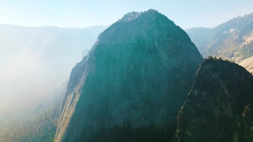 Bare cliff rock of Yosemite National Park, California, USA. Deep haze covering the horizon
