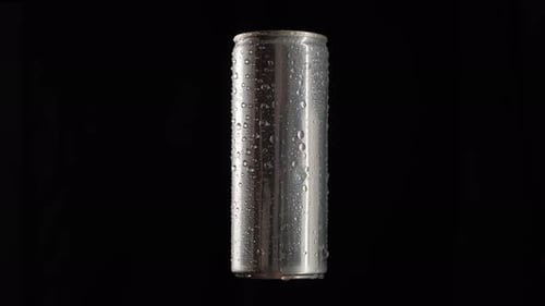 Wet Silver Can Against Black Background