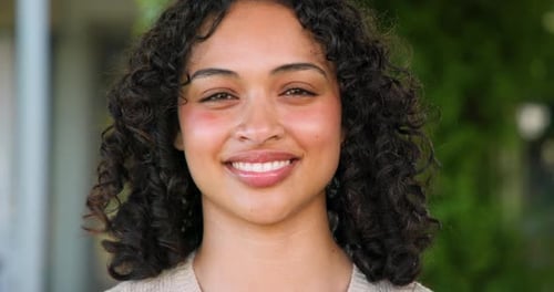 Attractive Woman Smiling and Laughing Cheerfully Outdoors