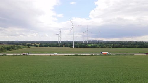 Wind turbines next to highway