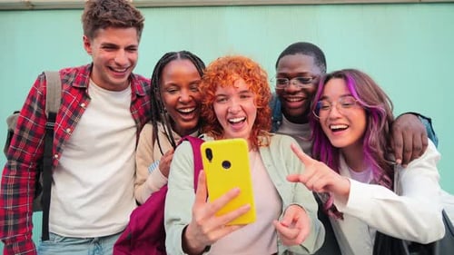 Diverse Group of Friends Smiling at Smartphone