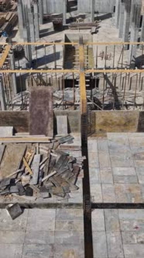 Vertical Video New Floor Construction in Progress With Engineers and Workers Building Walls Together