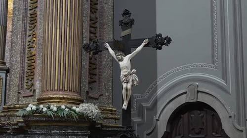 Crucifix statue in ornate Sanctuary of Sameiro interior.