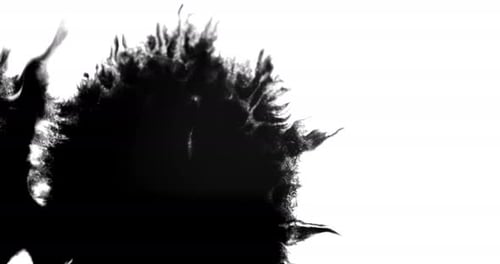 Expanding Black Ink Blob on White Background