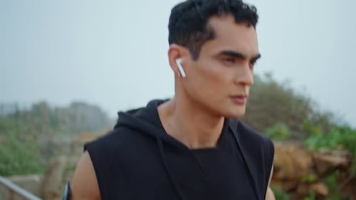 Man Jogging Outdoors on Cloudy Day
