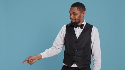 Man in Vest Points in Multiple Directions