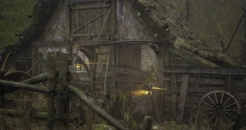 Old Rustic Building in the Woods with Mossy Roof and Faint Light at Dusk