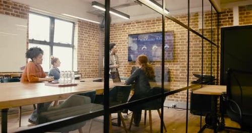Business People Presenting during Meeting in Boardroom Office, using Projection screen Technology