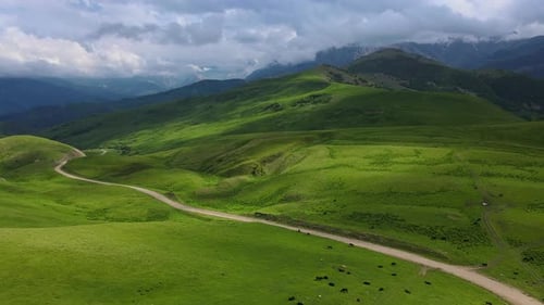 Actoprak's Green Mountain Pass Aerial View Day's Charm Cloud Embrace Majestic Mountain Pass Scenic