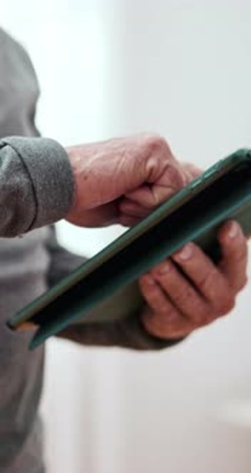 Close Up of Hands Using Tablet