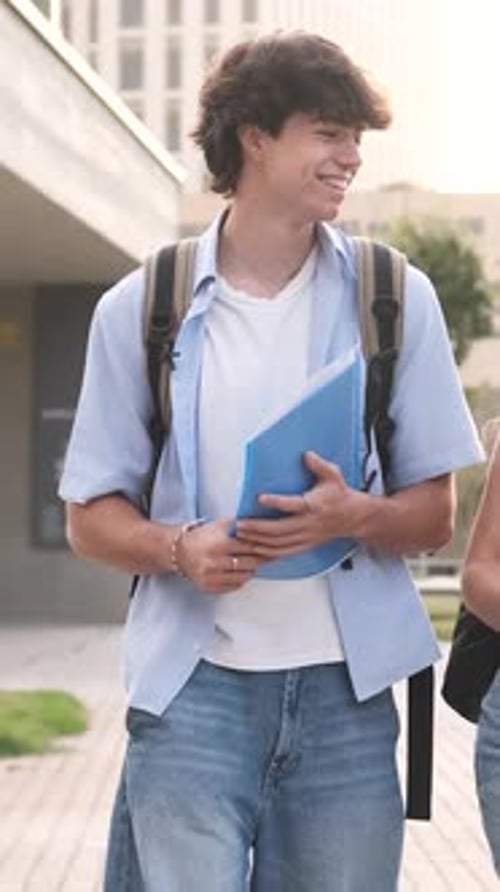 Cheerful Student Strolling Through a Lively College Campus