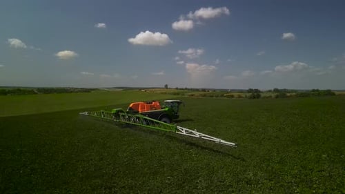 Spray Fertilize On Field With Chemicals In Agriculture Field
