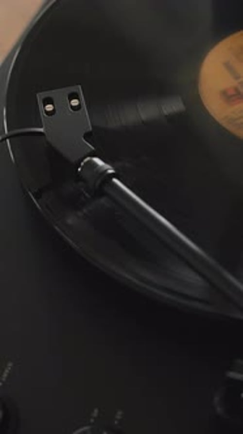 Record Player Needle on Spinning Vinyl Record