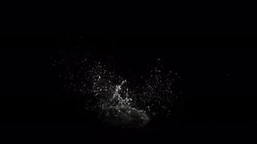 Abyss Collection: An object dropping in the water from above and splashing water over a black backgr