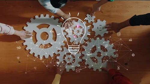 Collaboration and Innovation Concept with Gears and Light Bulb Idea Representation in an Office Sett