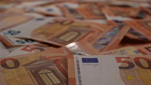 Pile of Orange Fifty Euro Banknotes Close-Up