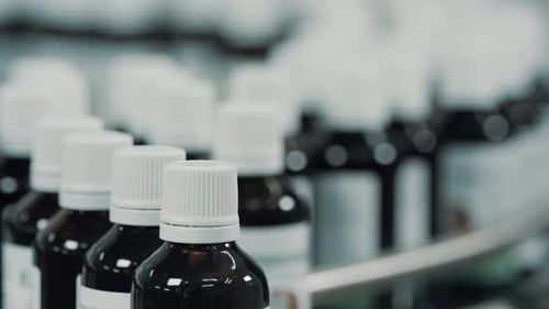 Medicine Bottles Moving on Conveyor Belt