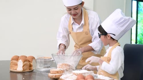 Professional pastry chef asian mom and son making bakery bread cake prepare delicious sweet food