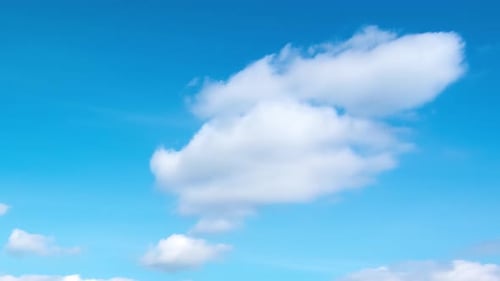 Blue Sky with White Clouds Passing By