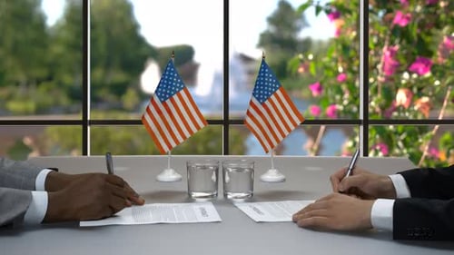 Business People Signing an International Agreement