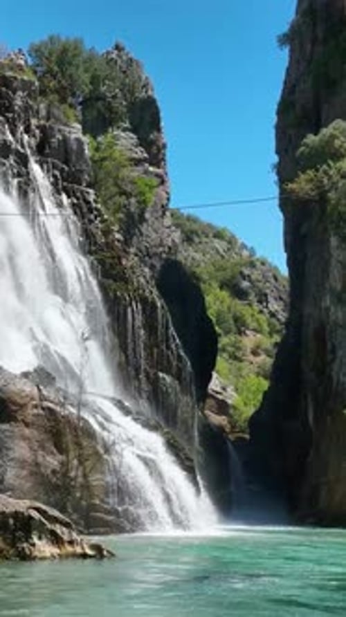 Vertical Video Cinematic Aerial Footage Captivating Waterfall As Background with Close Drone