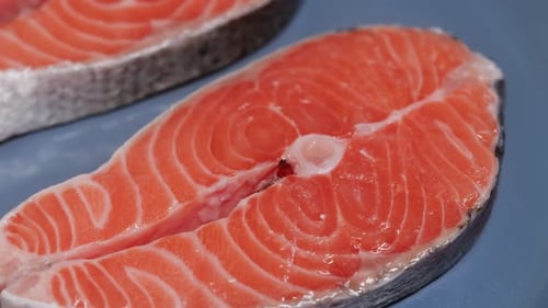 Salmon Steaks Frying in a Pan Close Up Showing Fish Texture During Cooking Healthy Lunch Preparation