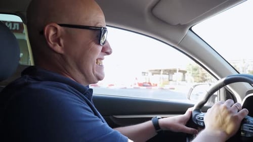 The Man is Angry in the Car He Honks While Standing in a Traffic Jam