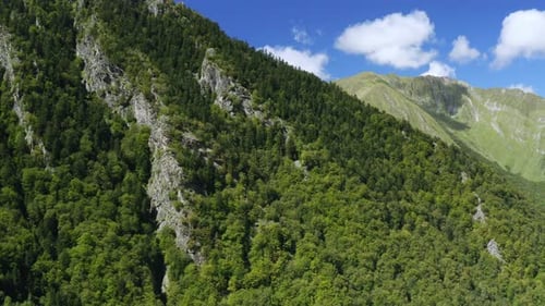 Low altitude flight over a mountain