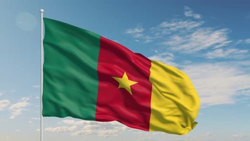 Patriotic Cameroon Flag Flowing Freely in the Wind Under the Sky