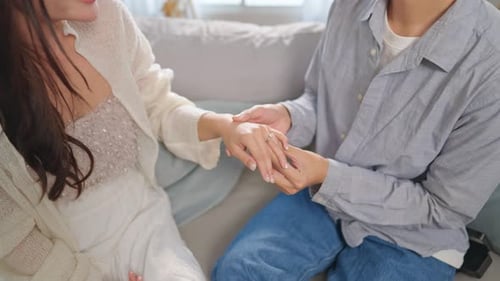 Close up of romantic man surprise girlfriend with a marriage proposal.