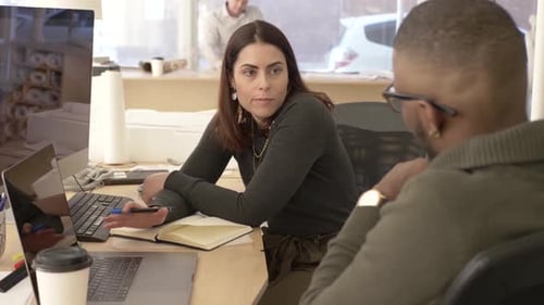 Woman and Man Meeting in Office Discussing Project