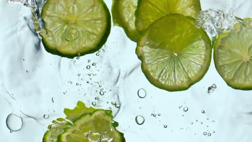 Citrus Pieces Floating Water in Super Slow Motion Close Up