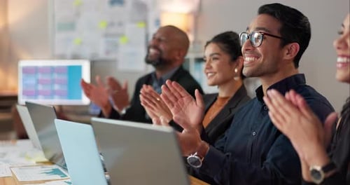 Professional Colleagues Clapping in Modern Workplace