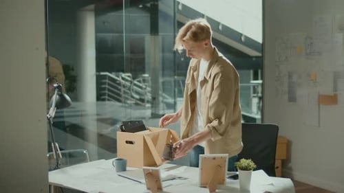 The Man Was Fired and He Packs Things in a Drawer Work in the Office