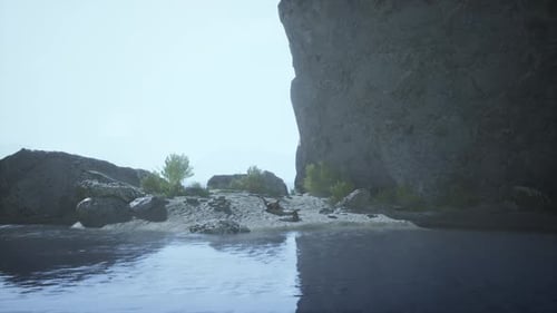 A Majestic Rock Formation Overlooking a Serene Body of Water