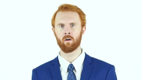 Shocked Man in Blue Suit with Red Hair