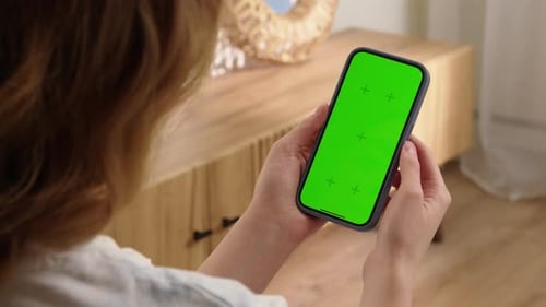 Woman Tap Green Screen on Mobile Cell Phone and Zoom in Photo Cellphone Display