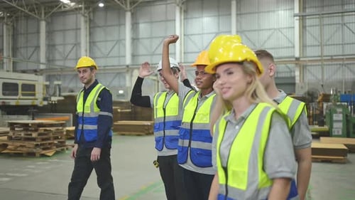 Diverse group of workers in a paper factory with the mood after work