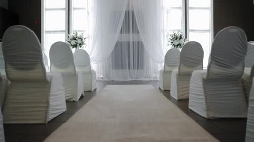 Walking up the isle of a beautiful wedding ceremony venue set up for a modern and beautiful wedding