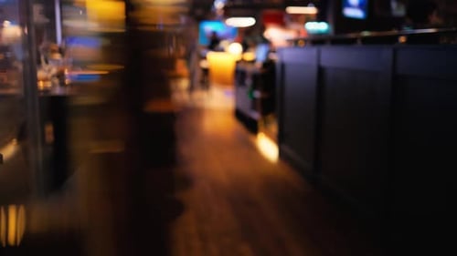 The Vibrant Nightlife Scene Unfolds in a Lively Bar Featuring a Soft Focus That Enhances the