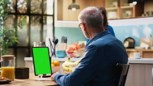 Vertical Chroma Key Tablet with Senior Man Enjoying Morning Routine