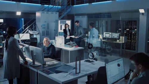 Team of engineers working on computers in office