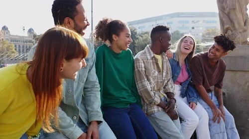 Happy Young Adults Talking Together Outdoors