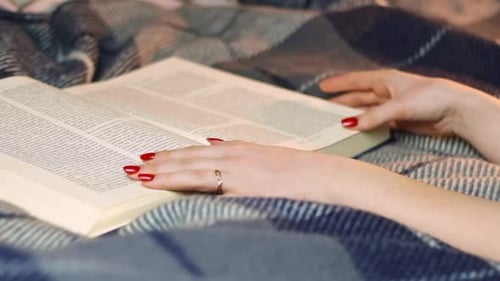 Reading Holy Bible by scrolling pages, closeup