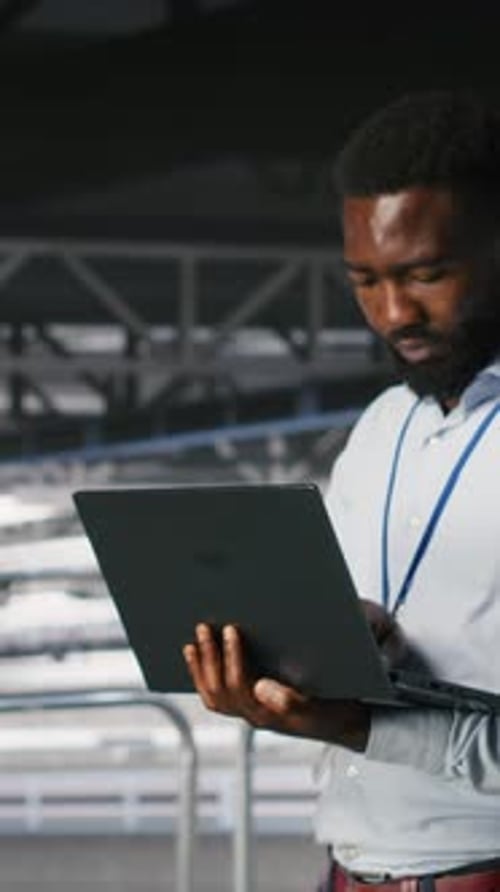 Vertical Video Data Center Coworkers Use Laptop to Monitor Neural Network LLM Visualization