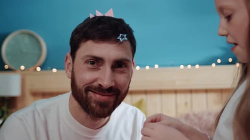 Father and Daughter Play Dress Up Together at Home