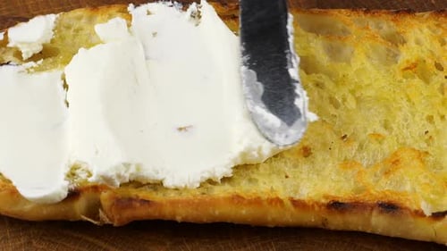 Half of a homemade ciabatta bread, toasted in olive oil and cut lengthwise